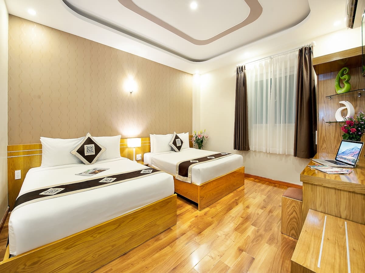Không gian phòng nghỉ Eden Central Hotel & Spa tối ưu ánh sáng và tiện nghi
